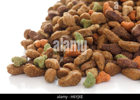 Mixed dry cat food on white surface Stock Photo