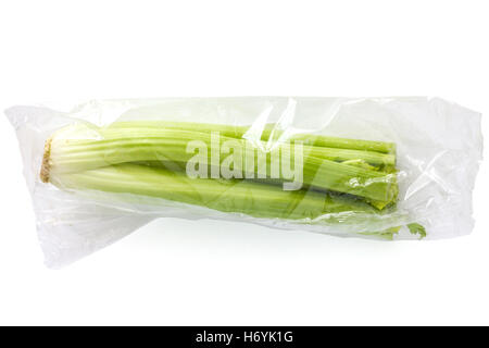 Whole celery sealed in a clear plastic bag. Stock Photo