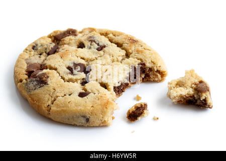 One light chocolate chip cookie, bite missing with crumbs, isolated. Stock Photo