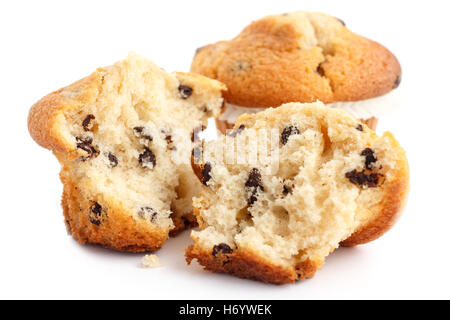 Broken light chocolate chip muffin on white. Stock Photo
