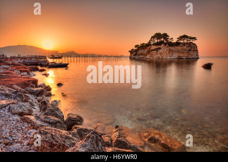 The sunrise at Agios Sostis Island  (Cameo) in Zakynthos, Greece Stock Photo