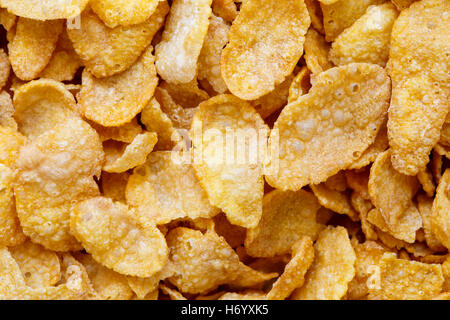 Background of dry cornflakes from above. Stock Photo