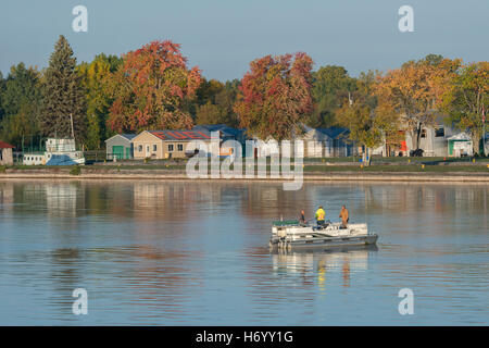 USA & Canada border. Scenic fall reflection view of the Saint Lawrence Seaway with fishermen. Stock Photo