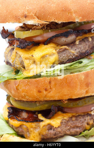 Greasy double cheese burger tower. Detail. Stock Photo