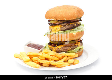 Double cheese burger and chips with ketchup on a white plate. Stock Photo