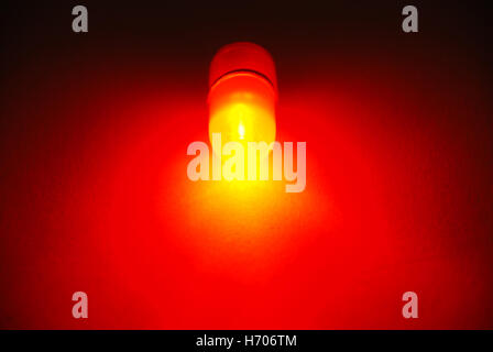 Fishing red LED power indicator isolated on black background Stock Photo