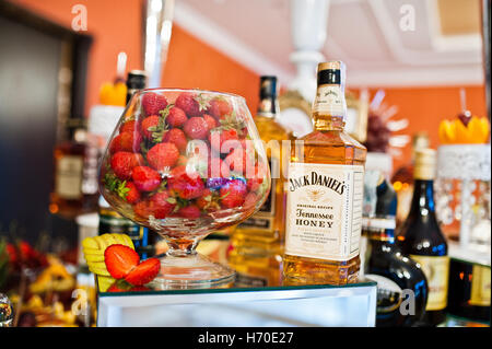 Hai, Ukraine - October 25, 2016: Jack Daniel's Honey on buffet table with strawberries Stock Photo