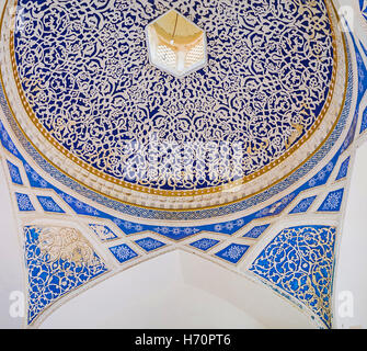 The beautiful decoration of the entrance gate of Khudayar Khan Palace, made of carved and painted plaster Stock Photo