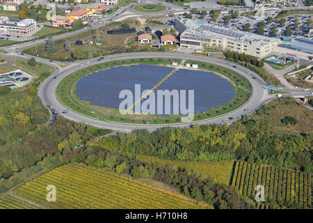 AERIAL VIEW. Photovoltaic panels installed inside a traffic circle. Affi, Province of Verona, Veneto, Italy. Stock Photo