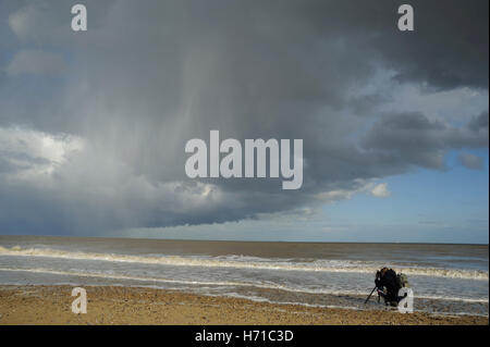 Storm and photographer at Covehithe Stock Photo