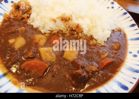 Japanese curry rice with gravy sauce of carrot, potato and beef in the restaurant of Osaka, Japan Stock Photo