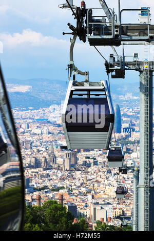 a beautiful modern ropeway against Barcelona Stock Photo