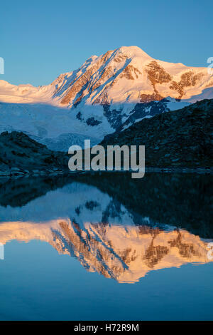 Evening reflection of Lyskamm in the Riffelsee, Zermatt, Pennine Alps, Valais, Switzerland. Stock Photo