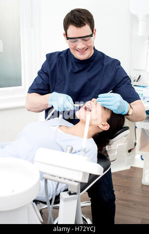 doctor physician medic medical practicioner woman medicinally medical female teeth male masculine dentist european caucasian Stock Photo