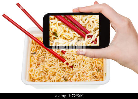 telephone phone glass chalice tumbler cup food aliment isolated look glancing see view looking peeking looking at photo camera Stock Photo