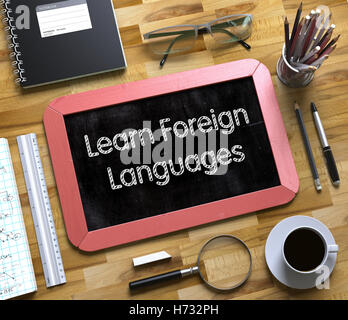 Learn Foreign Languages Concept on Small Chalkboard. 3D. Stock Photo