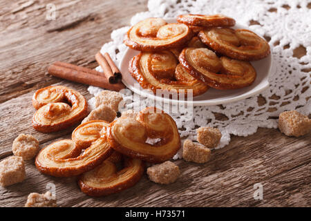 Palmiers biscuits with sugar and cinnamon on the table close-up, horizontal Stock Photo