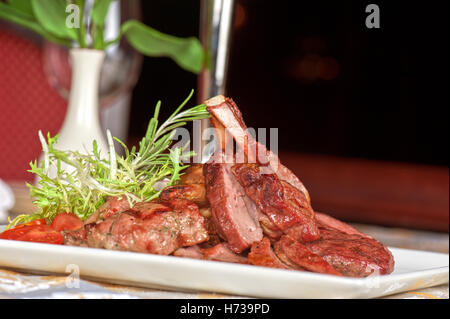 close food aliment pepper big large enormous extreme powerful imposing immense relevant closeup wood plate rare cow gourmet cut Stock Photo