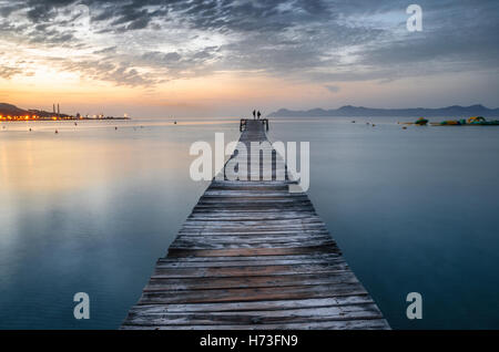 Majorca Puerto de Alcudia beach pier at sunrise in Alcudia bay in Mallorca Balearic islands of Spain Stock Photo