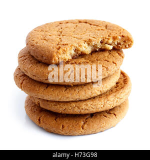 Stack of ginger biscuits with half biscuit on top. Isolated on white. Stock Photo