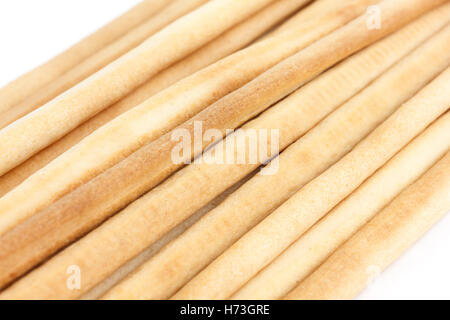 Thin grissini on white. Stock Photo