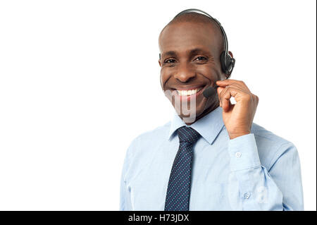 guy telephone phone talk speaking speaks spoken speak talking chat nattering office laugh laughs laughing twit giggle smile Stock Photo