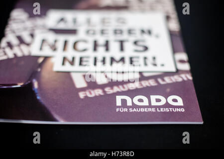 The logo of the National Anti Doping Agency Germany (NADA) can be seen on a brochure in Bonn, Germany, 27 October 2016. Photo: Maja Hitij/dpa Stock Photo