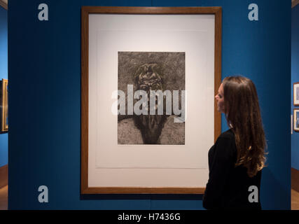 The Queen’s Gallery, Buckingham Palace, London, UK. 3rd November, 2016. Portraits by artists from Rubens and Rembrandt to Hockney and The Duke of Edinburgh go on display in new exhibition at The Queen's Gallery in an exhibition from 4 November 2016 to 17 April 2017. Photo: Lucien Freud, Self-Portrait: Reflection, 1996, with a member of Gallery staff. Credit:  artsimages/Alamy Live News. Stock Photo