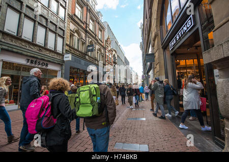 Tourists walking on Kalverstraat - main shopping street of Amsterdam, Netherlands Stock Photo