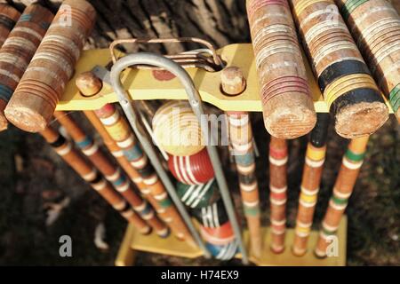 Old croquet set used in outdoor gatherings as a socially competitive recreational activity. Stock Photo