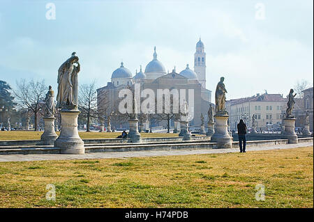 Prato della Valle is the best landscaped square in the city,decorated with many statues with the Basilica of St Giustina Stock Photo