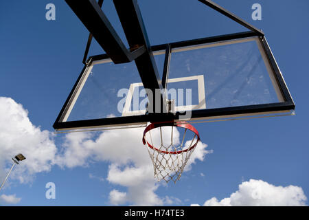 basketball backboard on blue cloudy summer sky background Stock Photo