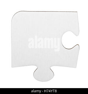 Single cardboard jigsaw puzzle piece isolated on white Stock Photo