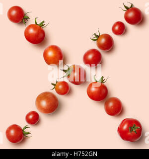 seamless pattern fresh cherry tomatoes isolated on a pink background, Stock Photo