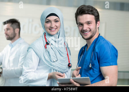 Saudi arab doctors working with a tablet. Stock Photo