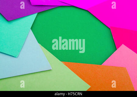 Paper cardboard. Colorful papers. Paper texture with orange green blue purple colors. Papers in background. Stock Photo