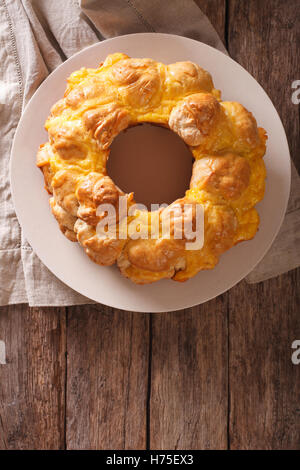Tasty monkey bread with cheese on a plate on the table. vertical view from above Stock Photo