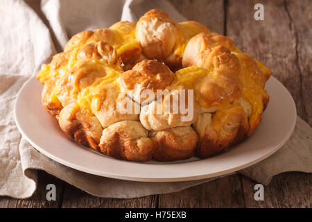 Delicious monkey bread with cheese close-up on a plate on the table. horizontal Stock Photo