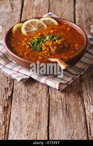 Thick Moroccan Harira soup in a bowl on the table. vertical Stock Photo