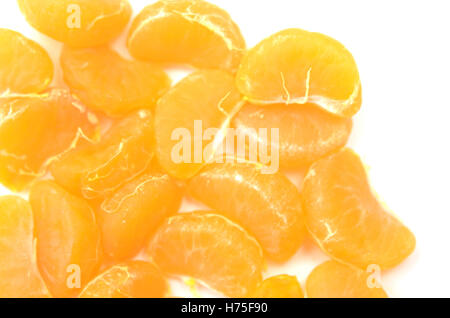 segments of ripe tangerine on white background Stock Photo