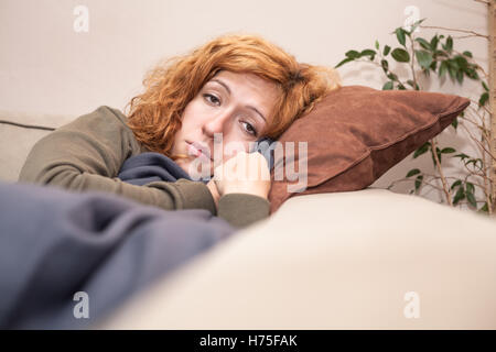 woman humans human beings people folk persons human human being women health female feeling bed face sad person frustration lie Stock Photo