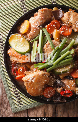 Dakjim braised chicken with vegetables in a Korean style close-up on a plate. vertical view from above Stock Photo