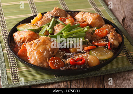 Korean cuisine Dakjim: chicken with vegetables and sesame close-up on a plate. horizontal Stock Photo