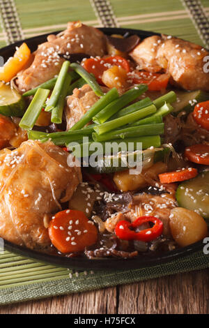 Dakjim braised chicken with vegetables in a Korean style close-up on a plate. Vertical Stock Photo