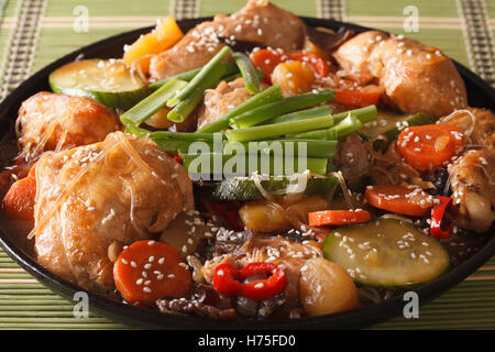 Andong jjimdak braised chicken with vegetables close-up on a plate. Horizontal Stock Photo