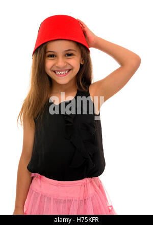 Beautiful Young Girl With Beautiful Smile Wearing a Fez Isolated on White Background Stock Photo