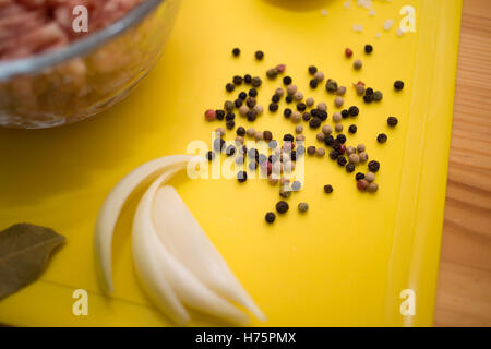 Minced meat in bowl with spices, selective focus Stock Photo