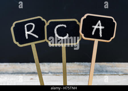 Business acronym RCA as Root Cause Analysis written with chalk on wooden mini blackboard labels Stock Photo