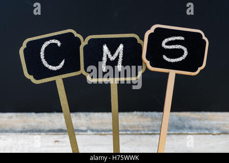 Business acronym CMS as Content Management System written with chalk on wooden mini blackboard labels Stock Photo