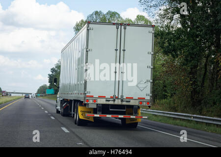 Rear view of semi truck on highway Stock Photo